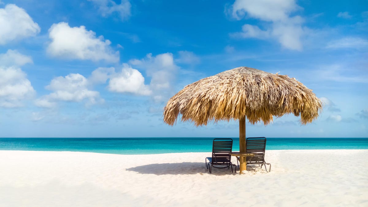 First-time visitors guide to Aruba — beach shade and turquoise water